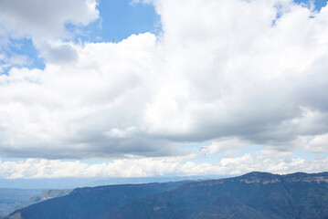 Paragliding in the Chicamocha Canyon area, Santander, Colombia. A paraglider in the sky, in the...