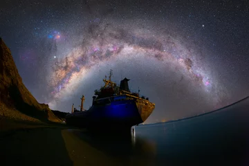 Photo sur Plexiglas Naufrage A ship washed ashore, photographed day and night