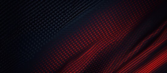 Obraz premium black carbon background combined with red