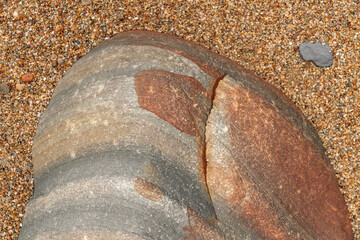 Natural rock texture of a colorful rock formations in silence beach (playa del Silencio) in...
