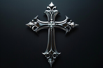 Metallic ornate cross on a dark background