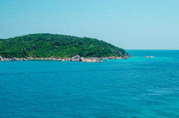 Fototapeta premium Tropical islands of ocean blue sea water and white sand beach at Islands. Thailand nature landscape