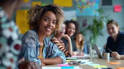Obraz premium A diverse group of professionals gathered around a table, engaged in a brainstorming session, sharing ideas, collaborating on projects, and working together towards a common goal, showcasing teamwork