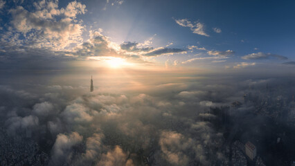 
The top of the Landmark 81 building, the tallest in Vietnam, floats in the clouds. Photo taken in October 2023