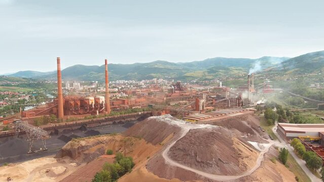 Drone Establishing Shot of an Old Iron Factory in the Eastern European City. Ecology Issue. Fossil Fuels Contamination. Carbon dioxide pollution. Zenica, Bosnia and Herzegovina