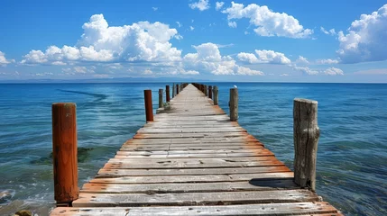 Fotobehang wooden pier on the sea © P