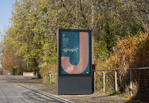 Mockup of customized vertical sign by trees
