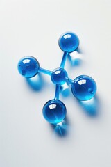 Blue glass spheres on a white surface, perfect for various design projects