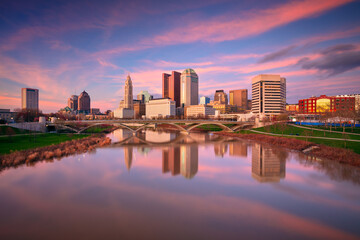Columbus, Ohio, USA. Cityscape image of Columbus , Ohio, USA downtown skyline with the reflection of the city in the Scioto River at spring sunset. - obrazy, fototapety, plakaty