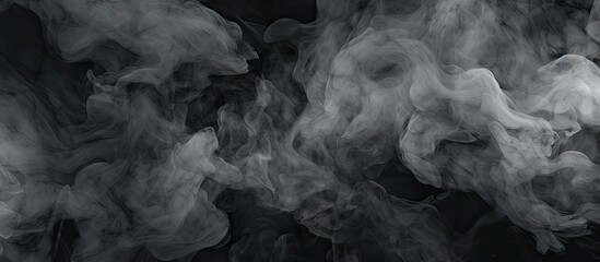 A close up of grey smoke billowing out of a pipe against a black background, resembling a cumulus cloud. This monochrome photograph captures a meteorological phenomenon in the darkness - obrazy, fototapety, plakaty