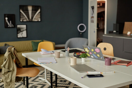 Background image of cluttered meeting table in modern office with no people copy space