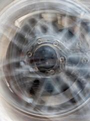 The motion blurred image of the vehicle wheel - 761540818
