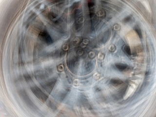 The motion blurred image of the vehicle wheel - 761540878