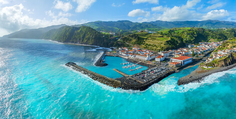 Breathtaking aerial view of Povoação, a picturesque town nestled among green hills on São Miguel island in the Azores.