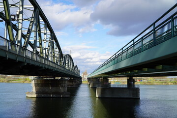 two parallel railway bridges over Donnau river in Vienna on a bright sunny day