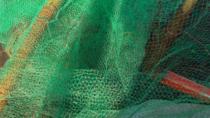 Green fishing net. Green Heap of Commercial Fishing Net.