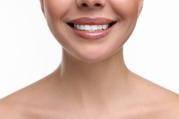 Woman with beautiful lips smiling on white background, closeup - obrazy, fototapety, plakaty