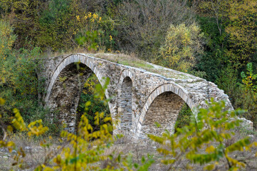 Fototapeta na wymiar View of a traditional stone bridge at Kosynthos river in Thrace, Greece