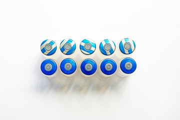 bottles with medicines for treatment and vaccinations on a white background. Routine vaccinations...