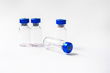 empty glass bottles on a white background. Routine vaccinations for animals and people