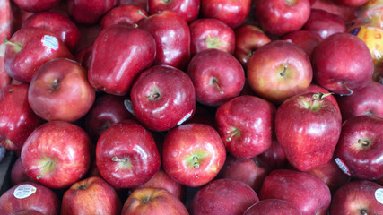 piles of apples being sold at the fruit shop