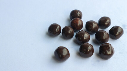 Chocolate candy isolated on white with space for your text.