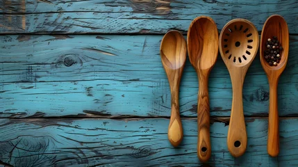 Zelfklevend Fotobehang Spoon and fork on a wooden background. © griffinke