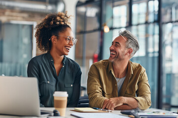people working together in office, two colleagues working and smiling 