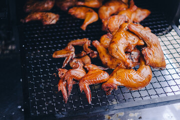 Pork being barbequed in a southern style pit over hickory wood.