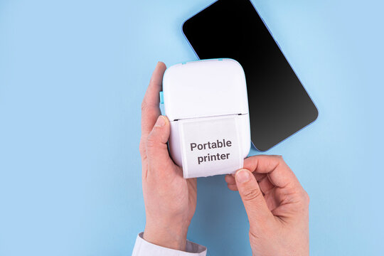 Portable Photo Printer, Mobile thermal pocket printer printer device with laptop, smartphone, mobile gadgets and thermal Paper Roll with Portable Printer text on it