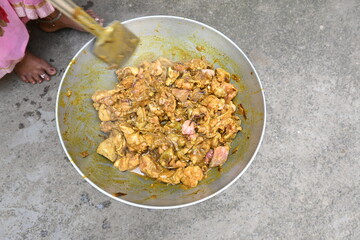 Cooking Goat meat in a Frying Pan on coal Stove at Home Kitchen. Sizzling chunks of juicy Goat meat fillet, with onions. Home delicious food. Make indian Goat meat curry in traditional style.