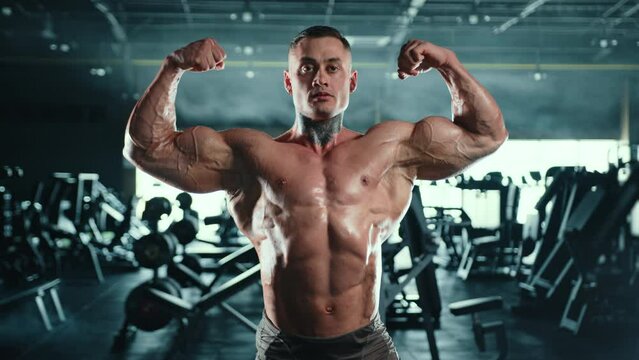 A bodybuilder flexes his chiseled muscles, confidently posing in the gym, reflecting the peak of physical conditioning and dedication to his sport. Camera 8K RAW. 