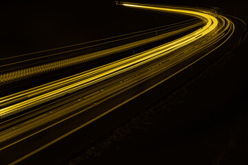 yellow car lights at night. long exposure