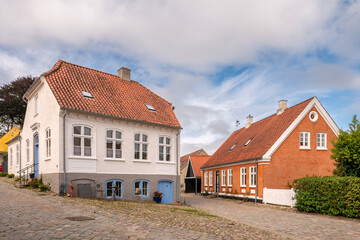 Streetscene of cobbled streets with historic houses in old town of Mariager, Nordjylland, Denmark