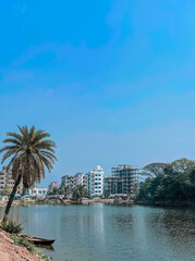 Obraz premium Harmonious Natural Tranquility Palm Trees, Nature, and Pondside Boating