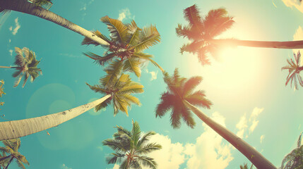 Tropical summer vacation background with palm trees and a blue sky - obrazy, fototapety, plakaty