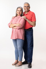 Portrait of loving senior couple over white background
