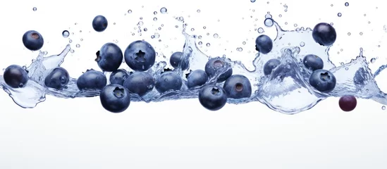 Fotobehang Blueberries creating a symmetrical pattern as they splash into a circle of water on a white background, captured in a stunning macro still life photography art piece © 2rogan