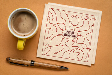 brainstorming concept with arrows representing thoughts, ideas, inputs and feedbacks, sketch on a napkin with coffee