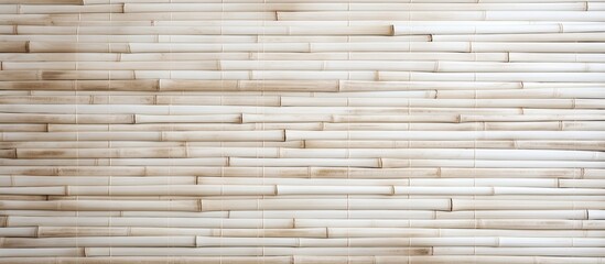 A detailed closeup of a brown hardwood wall constructed with wooden sticks. The natural shades and patterns of the wood create a beautiful beige siding that resembles a composite material
