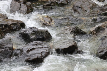 Big rocks in a splashing river