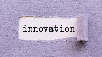 Torn Piece of Paper With the Word Innovation