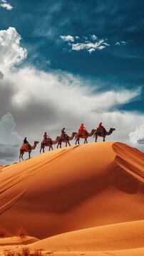 Camelcade on sand dune at desert