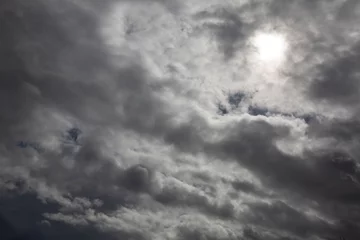 Stof per meter Cloudy sky and sun. Storm, storm clouds © casavella