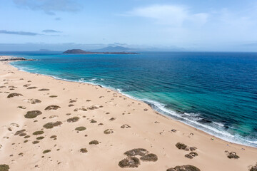 Stunning aerial morning view of the islands of Lobos and Lanzarote seen from Corralejo Beach (Grandes Playas de Corralejo) on Fuerteventura, Canary Islands, Spain,