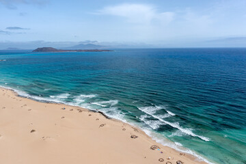 Stunning aerial morning view of the islands of Lobos and Lanzarote seen from Corralejo Beach (Grandes Playas de Corralejo) on Fuerteventura, Canary Islands, Spain,