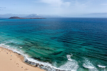 Stunning aerial morning view of the islands of Lobos and Lanzarote seen from Corralejo Beach (Grandes Playas de Corralejo) on Fuerteventura, Canary Islands, Spain,