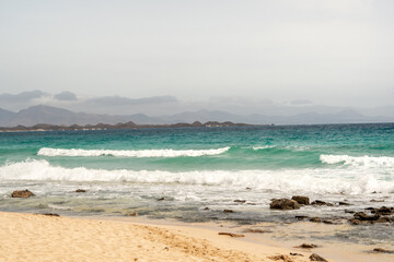 Stunning morning view of the islands of Lobos and Lanzarote seen from Corralejo Beach (Grandes Playas de Corralejo) on Fuerteventura, Canary Islands, Spain,