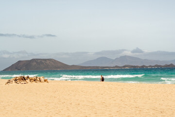 Stunning morning view of the islands of Lobos and Lanzarote seen from Corralejo Beach (Grandes Playas de Corralejo) on Fuerteventura, Canary Islands, Spain,