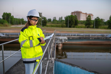 Environmental engineers work at wastewater treatment plants,Water supply engineering working at Water recycling plant for reuse